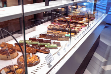 Various assortment of desserts confectionery on the counter in a bakery