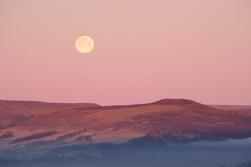 A full moon rising over Win Hill, Peak Distirct, UK