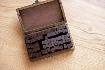 Vintage Wooden Letterpress Blocks in Rustic Box on Table