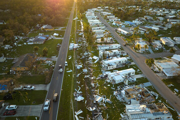 Severely damaged houses after hurricane Ian in Florida mobile home residential area. Consequences...