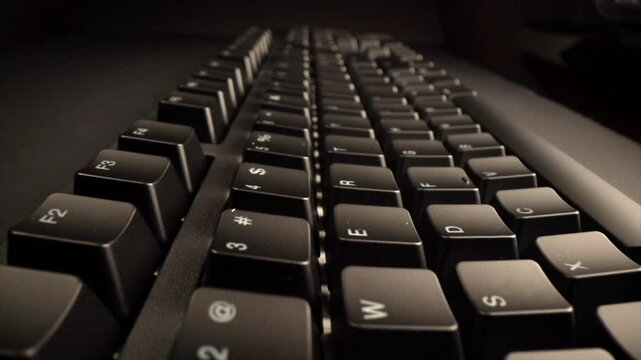 Showcasing six sequential close ups of a black keyboard featuring white characters against a dark background