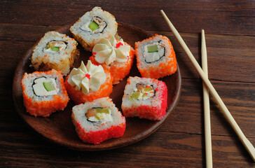  Japanese cuisine - California rolls on a ceramic plate