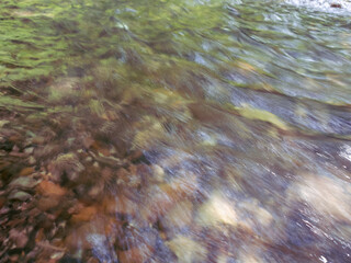 The river, with its rapid flow and majestic cliffs, creates a breathtaking landscape, reflecting the strength and beauty of the wild nature