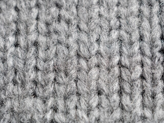 A textured gray knitted fabric ideal for cozy pieces and stylish clothing