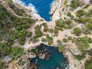 Aerial View of Rugged Coastline and Azure Waters..
