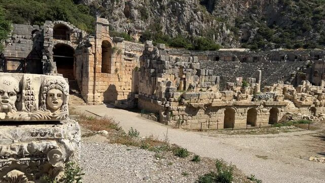 Ruins of the Roman amphitheater and the Lycian rock tombs at the Myra Ancient City in Demre, Turkey