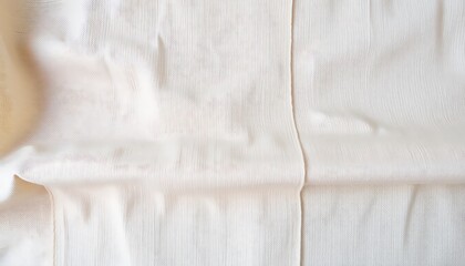 A cozy wallpaper with soft textures of linen and wool in neutral beige and cream tones, layered gently to evoke the warmth of home decor and minimalistic comfort.