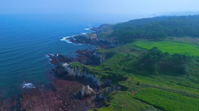 Aerial view from a drone of the coastal landscape and crops in the area around Cabo Cebes in Tapia de Casariego. Asturias. Spain. Europe