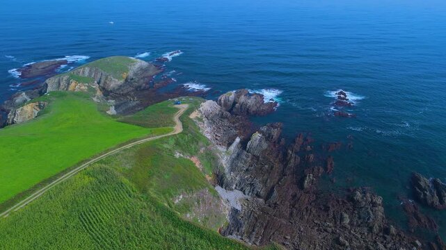 Aerial view from a drone of the coastal landscape and crops in the area around Cabo Cebes in Tapia de Casariego. Asturias. Spain. Europe