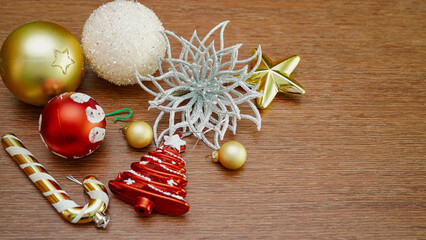 Christmas composition. a pattern of Christmas balls on wooden background. Flat lay, top view New year decor.