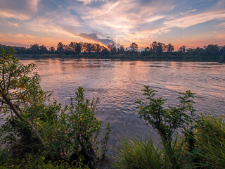 Obraz premium Sunset Over The River