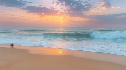 Obraz premium Person meditating on a sandy beach during sunrise with ocean waves in the background