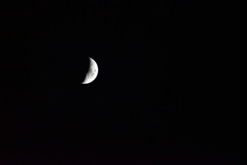 Waxing crescent moon against the night sky