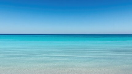 Fototapeta premium Tranquil Ocean View with Crystal Clear Waters and Calm Waves Under a Bright Blue Sky, Evoking Peaceful Escape and Natural Beauty for Relaxation and Inspiration