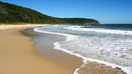 Fototapeta premium Serene beach landscape with golden sand, gentle waves, lush greenery, and clear blue skies, perfect for relaxation and nature appreciation in a coastal paradise