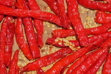Dried red chilies with exposed chili seeds. Chilies are being dried in the sun to make seeds....