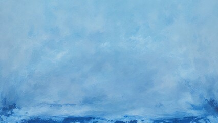 Fototapeta premium A soft, hazy blue sky with white clouds and a subtle, distant horizon.