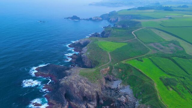 Aerial view from a drone of the coastal landscape and crops in the area around Cabo Cebes in Tapia de Casariego. Asturias. Spain. Europe