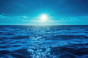 Fototapeta premium Vibrant blue ocean with a glowing flare effect