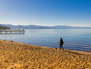 Female Tourist Walking on  Kings Beach, Kings Beach State Recreation Area, California, USA