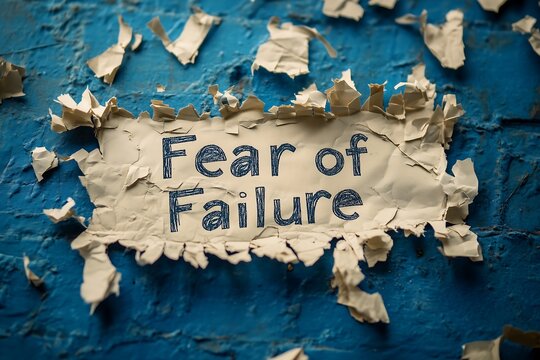Motivational message on a textured blue wall, highlighting the challenge of overcoming fear of failure. - Powered by Adobe