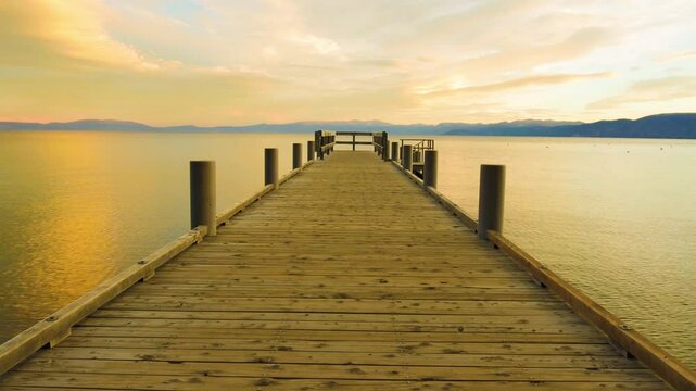 Wooden Pier and Clouds Reflecting on Lake Tahoe at Sunrise, South Lake Tahoe, California, USA