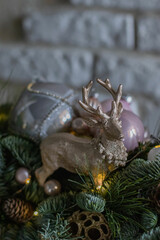 Christmas gold Deer figure. Home decoration, nobilis, pine needles Christmas composition with beautiful decoration. Festive Decor, Christmas Decor.