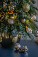 A gift version of the small Christmas tree. Natural nobilis. Gold balls. Christmas tree Handmade. New year. Ideal decoration article for office and home tables.