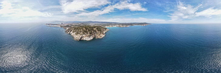 Fototapeta premium Aerial cityscape view of beach and Mediterranean Sea along Costa Brava in Palamos Catalonia