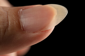 Clean normal long fingernail without color or coating on nail. Long clean fingernail to show...