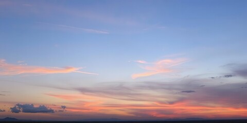 Fototapeta premium Pastel hues of pink, orange, and purple paint the sky in a beautiful cloudy sunset, gentle, outdoors, dusk