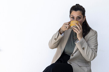 Portrait of entrepreneurial woman and mother having a cup of coffee