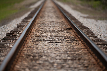 Obraz premium Industrial landscape. Railway track. Train is coming. Railway track for trains. The railways for the train. Railway crossing. Railway junction. Heavy industry. Railways track.