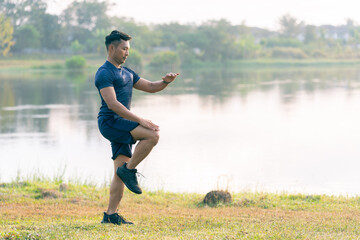 Man jogging in the park Man running on a sunny day Smile and have fun with outdoor activities, motivation, fitness, exercise. and male runners in exercise