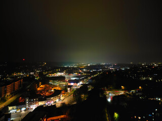 Obraz premium High Angle View of Illuminated Luton City and Downtown Homes During Dark Night. High Angle Footage Was Captured From Medium High Altitude with Drone's Camera on November 9th, 2024, England UK.