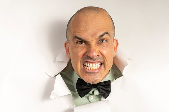 48 year old man in casual clothing and a bow tie, with only his head on a cardboard, showing emotions_2.