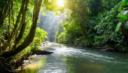 Obraz premium Glistening River Meandering Through a Dense Tropical Rainforest, With Vibrant Greenery Covering the Riverbanks and Bright Sunshine Streaming Through the Canopy