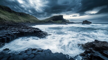 A dramatic capture of the rugged coastline and sea stacks of Giant's Causeway in Northern Ireland, with hexagonal basalt columns under the dramatic light of a stormy sky