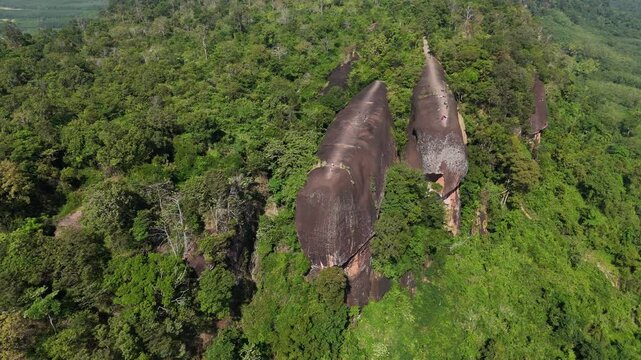 Aerial view of an iconic Three Whales Rock (in Thai called Hin Sam Wan) a 75-million-year-old rock formation protruding out of a mountain in Phou Sing, Bueng Kan Province, Thailand.
