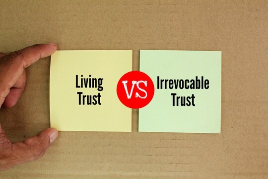 colored paper with living trust vs. irrevocable trust. Revocable trusts are easier to set up than irrevocable trusts.