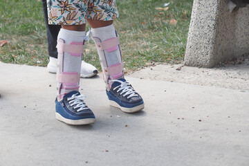 Child cerebral palsy disability, legs orthosis.