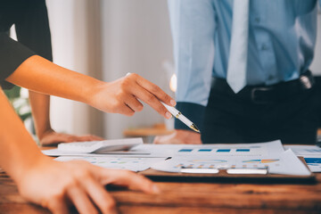 Fund managers team consultation and discuss about analysis Investment stock market at office