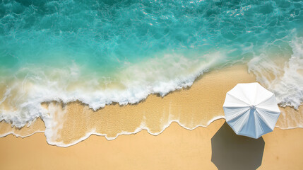 Obraz premium White beach umbrella on a tropical beach with turquoise water gently lapping the shore