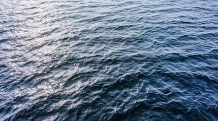 Abstract metallic color of water surface Aerial sea surface covered with tiny choppy waves reflecting silver light Aerial view to deep grey water in river with sunlight Aerial view of Adriatic Sea