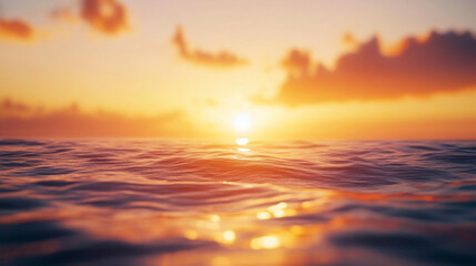 Obraz premium Beautiful sunset over calm ocean waters with vibrant colors reflecting on the surface