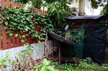 Closeup of Black satellite dish Located on the lawn In the garden near the house with natural background at Thailand.
