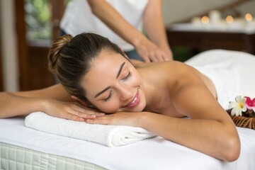 Fototapeta premium A woman enjoys a soothing massage in a tranquil spa, her face relaxed as a therapist works on her back. Soft lighting and calming decor create a peaceful atmosphere, enhancing the overall experience o