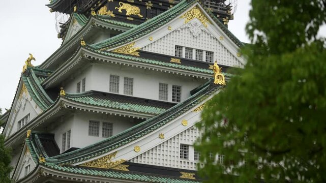 Pan footage of the historical Osaka Castle on a cloudydaytime in Chuo-ku, Osaka, Japan