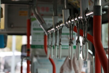 Japanese bus with a button to press when passengers are going to get off at the next stop