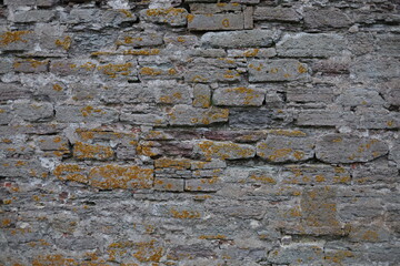 The texture of the destroyed brickwork of the Middle Ages. Preserved fortress walls.